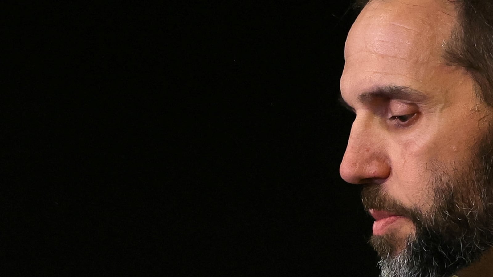 Special Counsel Jack Smith looks on as he makes a statement to reporters.