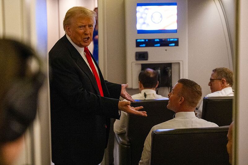 US President Donald Trump speaks to members of the press aboard Air Force One as he heads to Joint Base Andrews in Maryland after departing West Palm Beach, Florida on November 2, 2025.
