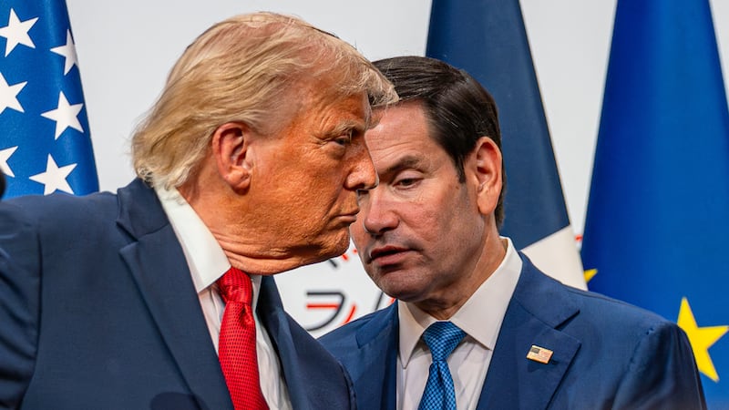 Secretary of State Marco Rubio repeats a Japanese reporter's questions spoken in English to President Donald Trump during his press conference at the 2026 G7 Summit in France on June, 17 2026.
