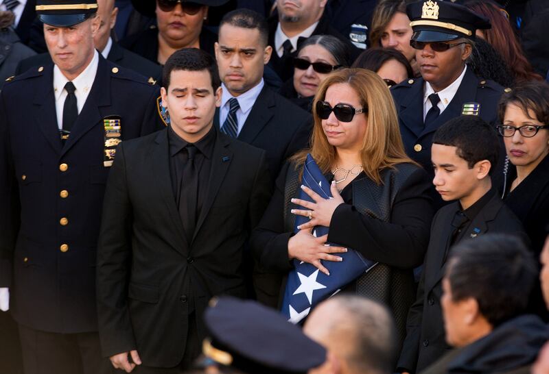 galleries/2014/12/27/the-nypd-says-farewell-to-officer-ramos/141227-police-funeral-03_yzpkxw