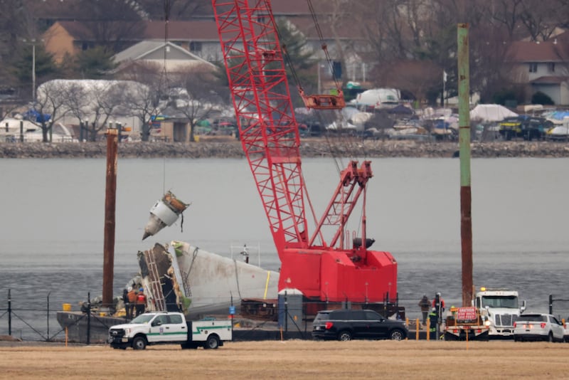 ARLINGTON, VIRGINIA - FEBRUARY 05: Pieces of American Airlines flight 5342 recovered from the Potomac River are brought to shore during recovery efforts on February 05, 2025 in Arlington, Virginia. An American Airlines flight from Wichita, Kansas collided midair with a military Black Hawk helicopter while on approach to Ronald Reagan Washington National Airport on January 29, 2025 outside of Washington, DC. (Photo by Kayla Bartkowski/Getty Images)