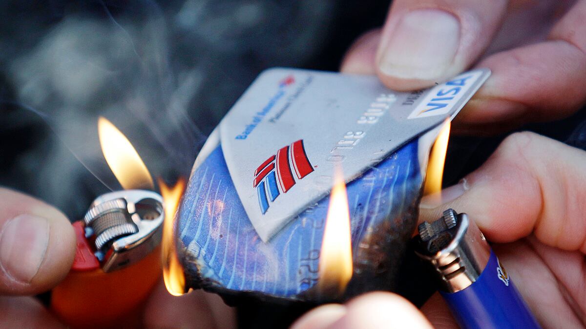 cheats/2011/10/28/big-banks-backtrack-on-debit-fees/bank-america-burn-debit-card-cheat_jsbage