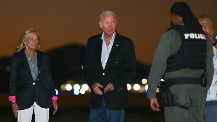U.S. President Joe Biden and First Lady Jill Biden greet people as they make their way to board Air Force One before departing Henry E. Rohlsen Airport in Christiansted, Saint Croix, on the U.S. Virgin Islands, on January 2, 2024.