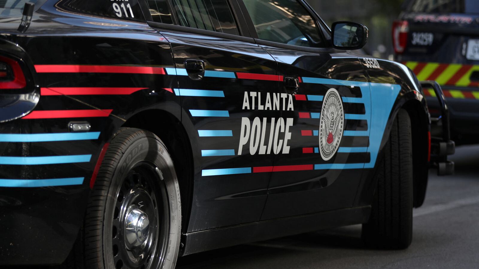 View of the side of an Atlanta Police vehicle. Authorities are investigating the cause of a fire at the Atlanta Police Training Academy on Saturday morning after “incendiary devices” were found at the scene.