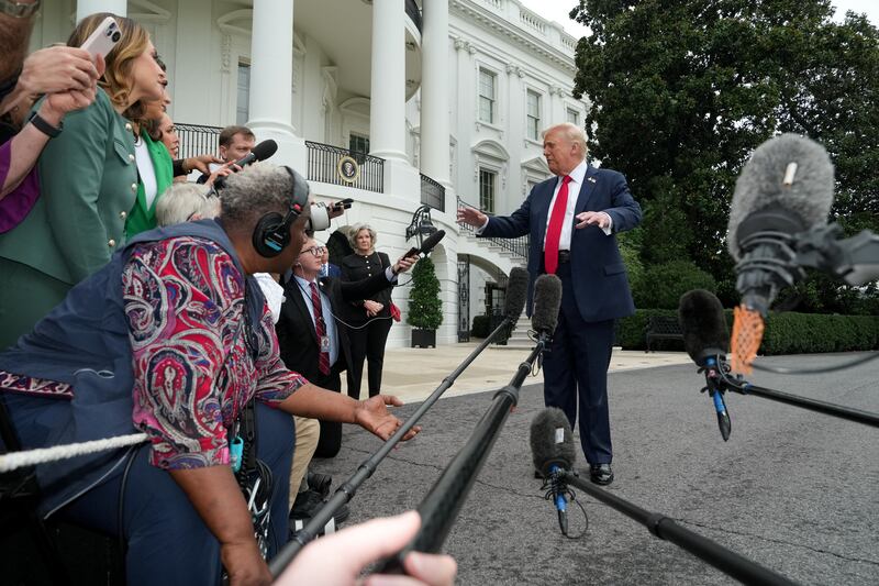 U.S. President Donald Trump speaks to the press before boarding Marine One