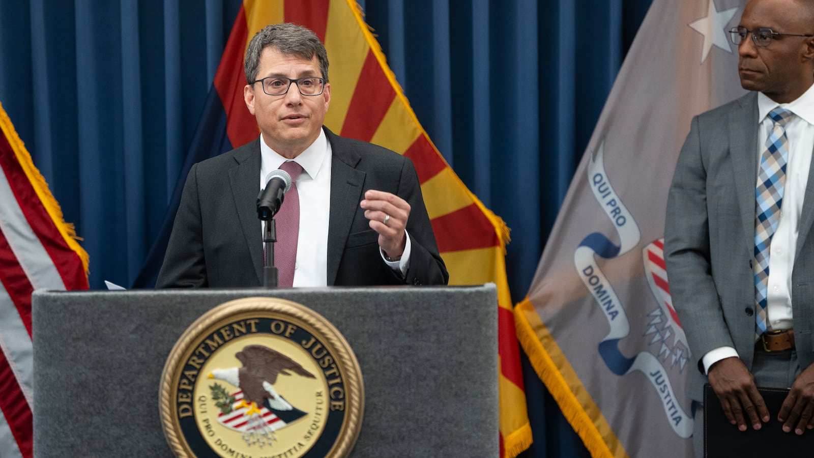 U.S. Attorney for the District of Arizona Gary Restaino speaks alongside FBI Phoenix FIeld Office Special Agent in Charge Akil Davis