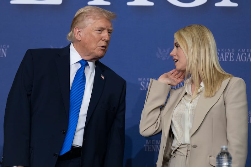 President Donald Trump interacts with then General Attorney Pam Bondi, on March 23. Democrats have accused her of participating in a cover-up over the Epstein files.