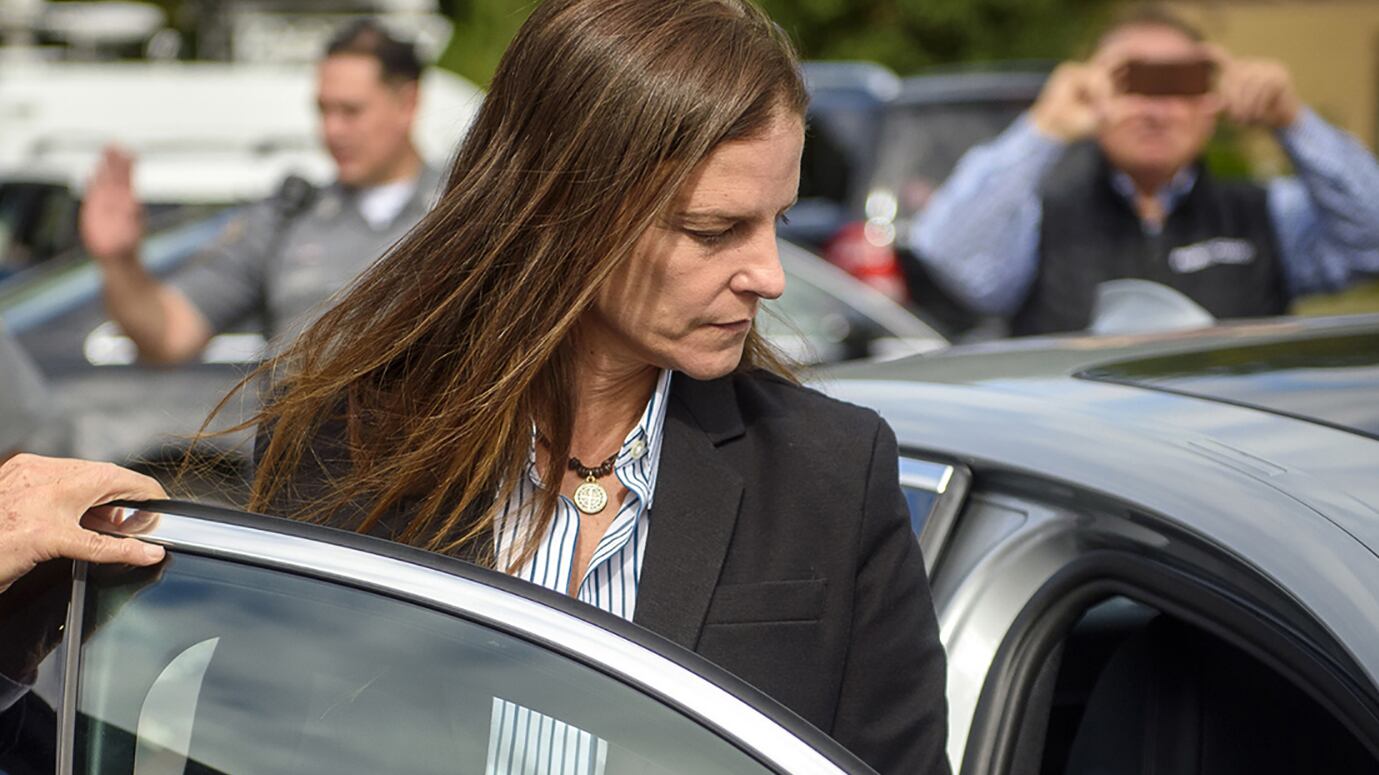 A photo of Michelle Troconis leaving court.