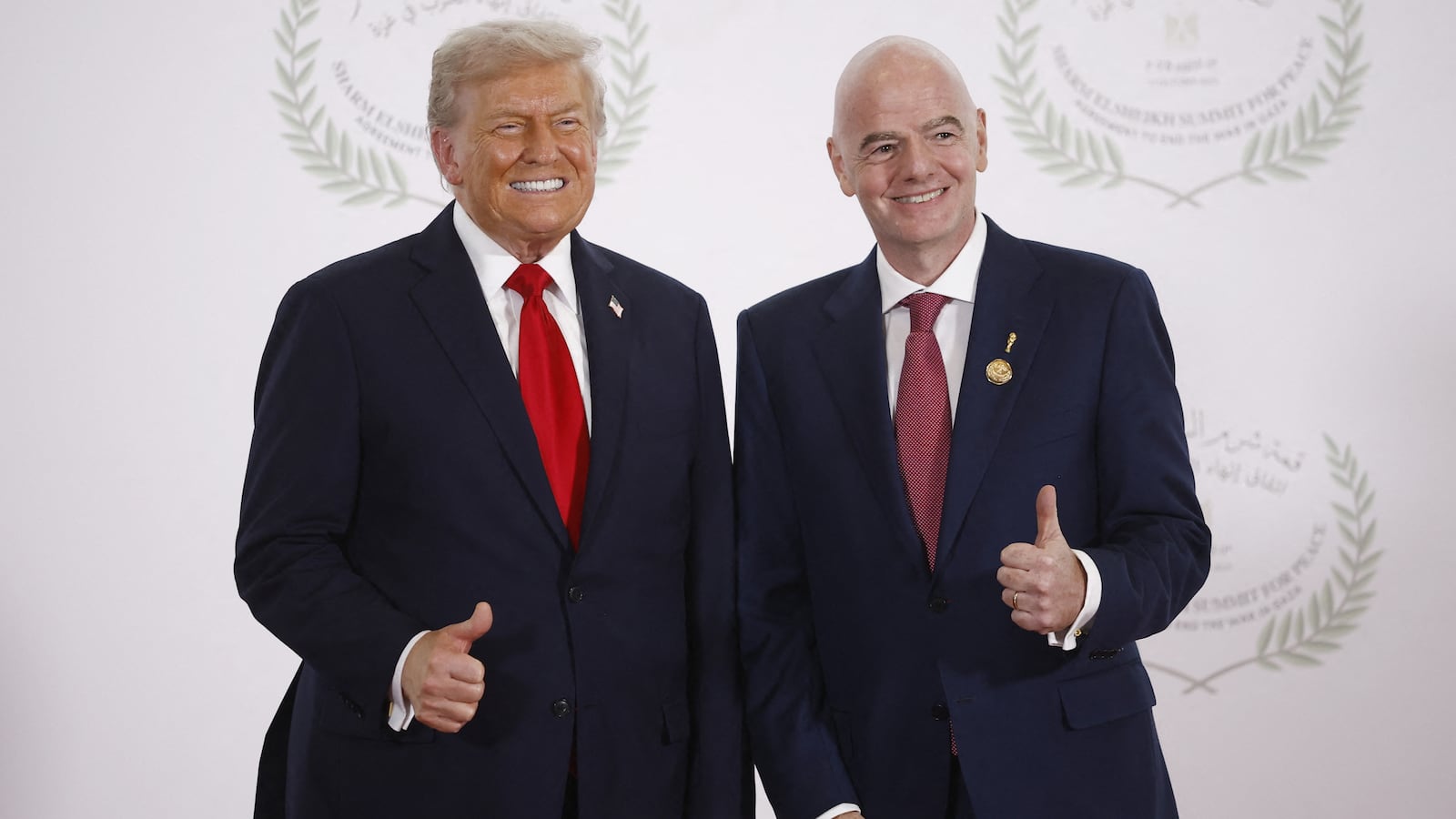 FIFA President Gianni Infantino (R) and US President Donald Trump pose during a summit on Gaza in Sharm el-Sheikh.