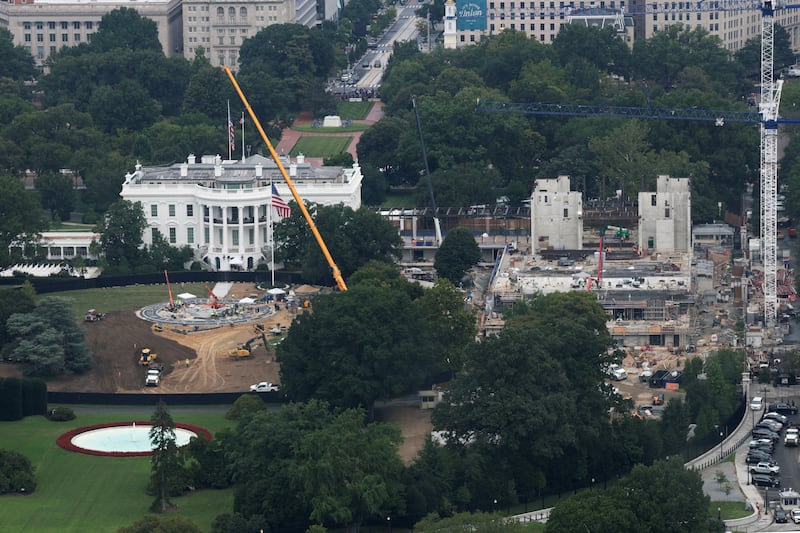 The helipad (left) and ballroom (right) under construction at the White House in August.