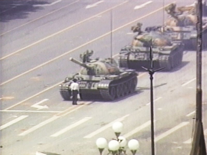 A lone demonstrator stands down a column of tanks June 5, 1989 at the entrance to Tiananmen Square.