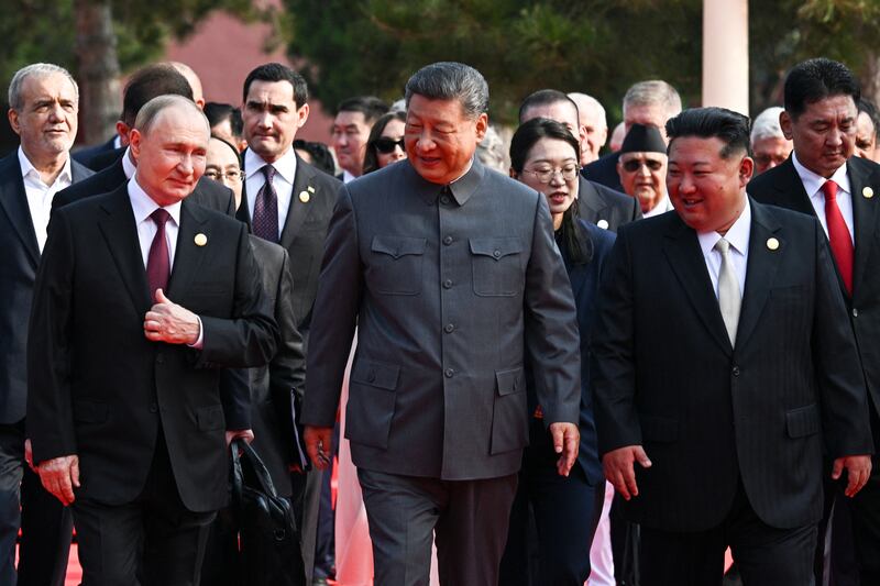 Russia's President Vladimir Putin walks with China's President Xi Jinping and North Korea's leader Kim Jong Un before a military parade marking the 80th anniversary of victory over Japan and the end of World War II, in Beijing's Tiananmen Square. on September 3, 2025. (Photo by Sergey Bobylev / POOL / AFP) (Photo by SERGEY BOBYLEV/POOL/AFP via Getty Images)