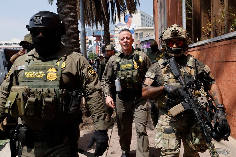 Gregory Bovino, Chief Patrol Agent of the El Centro Sector and Commander-Operation At Large CA (center), marches with federal agents to the Edward R. Roybal Federal Building on Aug. 14, 2025 in Los Angeles, CA.