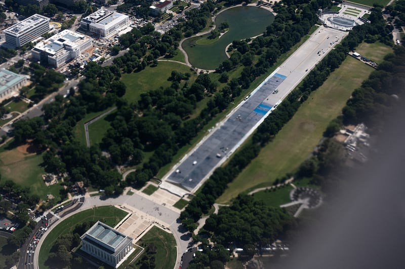 An aerial view, taken through the window of an airplane, of the ongoing renovations to the Lincoln Memorial reflecting pool, as workers add a layer of blue paint ordered by U.S. President Donald Trump, in Washington, D.C., U.S., May 15, 2026. REUTERS/Aaron Schwartz  REFILE - ADDING INFORMATION "TAKEN THROUGH THE WINDOW OF AN AIRPLANE\