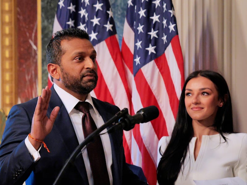 FBI Director Kash Patel speaks as his girlfriend Alexis Wilkins (C) looks on during his swearing-in ceremony on Feb. 21, 2025, in Washington, DC.