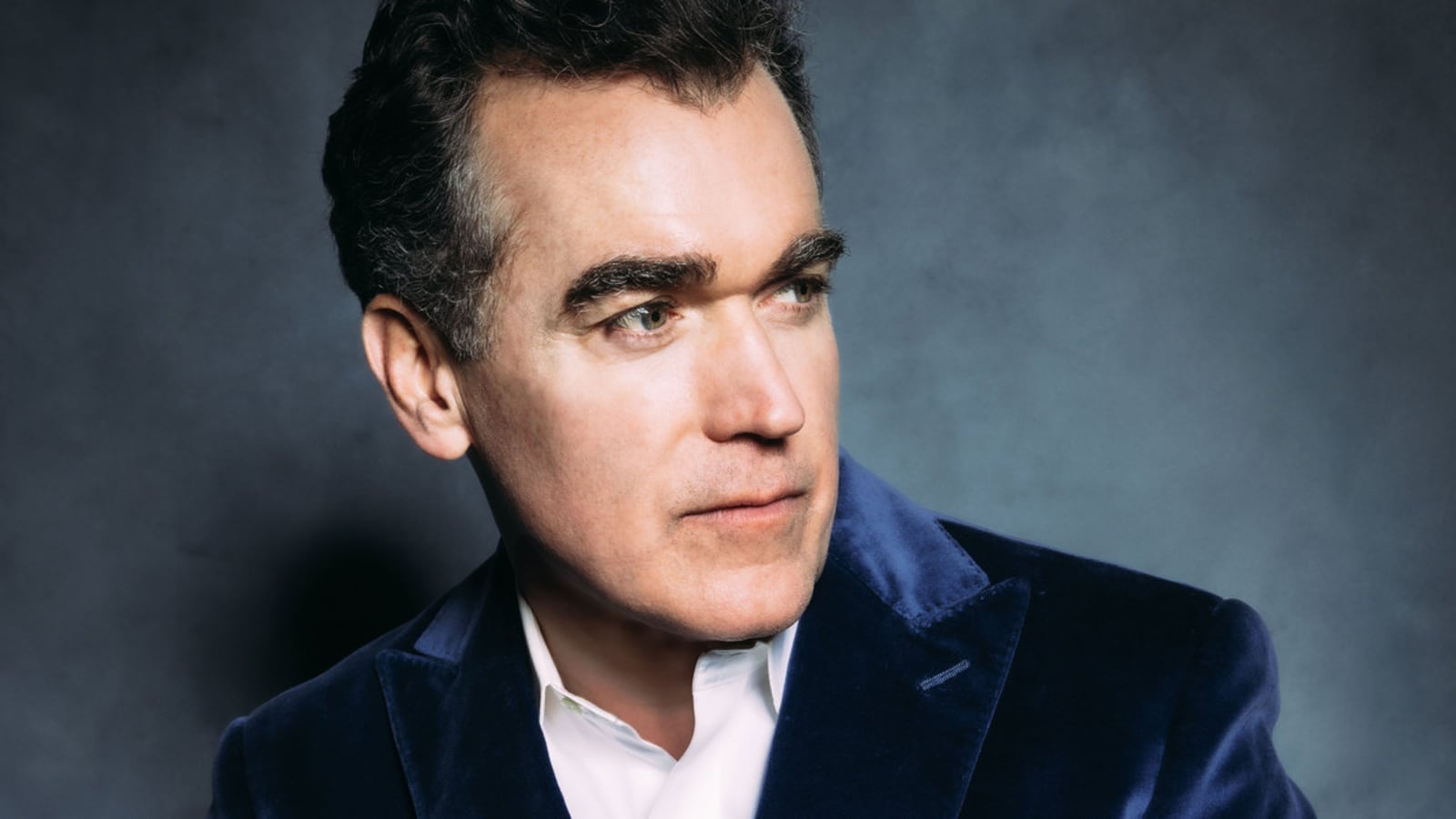 A close-up portrait of Brian d’Arcy James