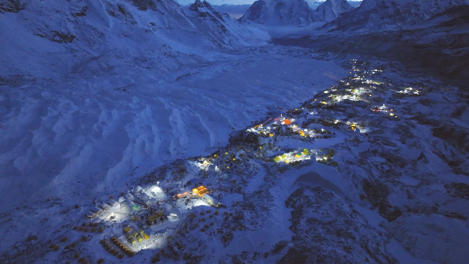 An aerial photo of a base camp at Mount Everest with the peak in the background