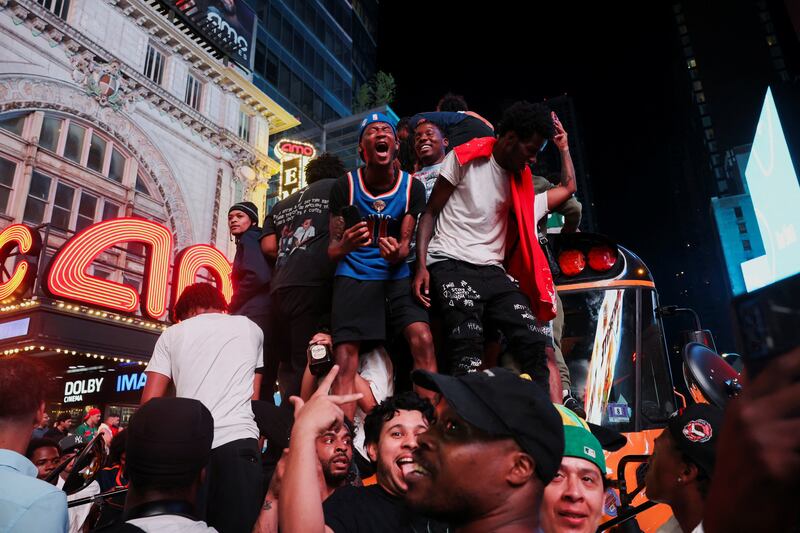 Fans gather along 42nd Street in Times Square, on the day of Game 5 of the NBA Finals between the New York Knicks and San Antonio Spurs, in New York City, U.S., June 13, 2026.