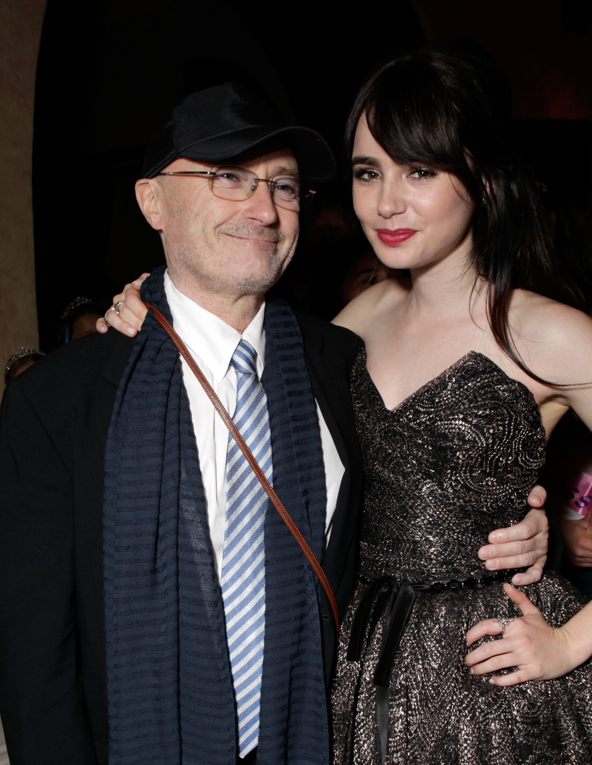 Musician Phil Collins and daughter Lily, then 22, attend the after-party for the premiere of 'Mirror Mirror' in Hollywood, California, on March 17, 2012.
