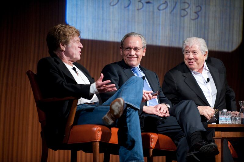 Legendary newsmen Bob Woodward (c) and Carl Bernstein (r) listen to a question from actor Robert Redford (l) during a panel discussion on Watergate in conjunction with an exhibit of memorabilia from their reporting that brought down the Nixon White House in 1974. Redford played Woodward in the hit movie "All the President's Men".