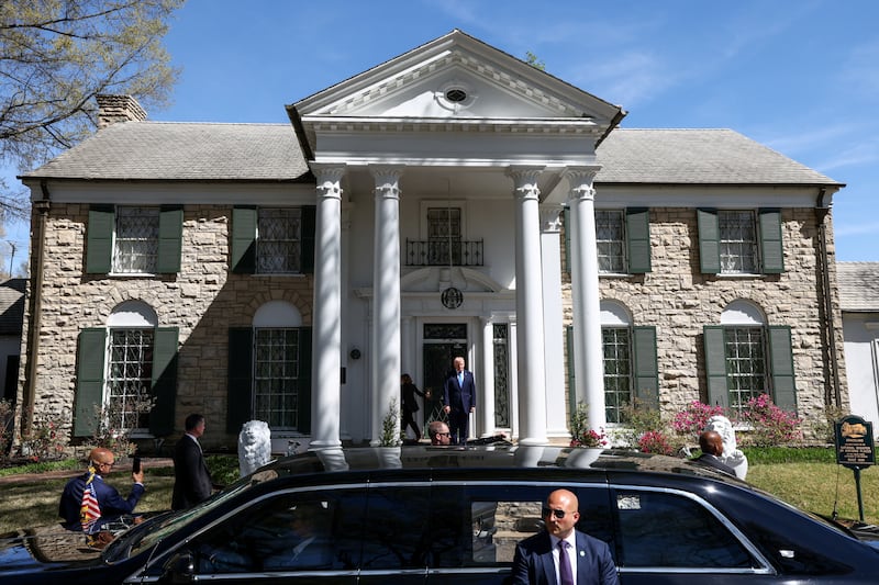 Donald Trump stands at the entrance of Graceland, the home of Elvis Presley, in Memphis, Tennessee, U.S.