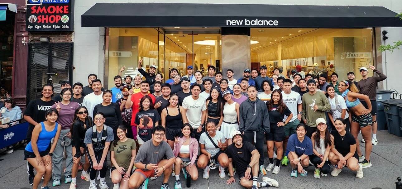 Members of the Paso Run Club pose outside a New Balance store.