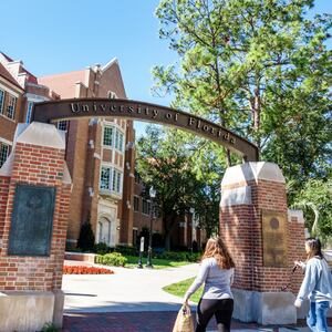Gainesville, University of Florida, campus entrance with students.