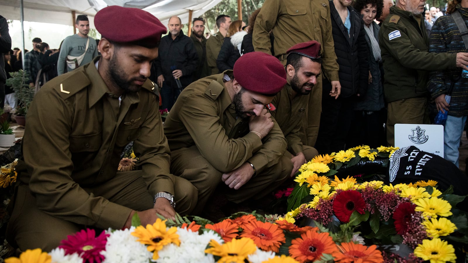 Family and friends mourn during the funeral of IDF soldier Maj. Shai Termin