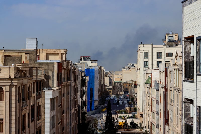 A plume of smoke rises following a reported explosion in Tehran on February 28, 2026. Two loud blasts were heard in Tehran on February 28 morning by AFP journalists, and two plumes of thick smoke were seen over the centre and east of the Iranian capital. Israel's defence ministry announced it had launched a "preemptive strike" on Iran as sirens sounded in Jerusalem and people across the country received phone alerts about an "extremely serious" threat. (Photo by ATTA KENARE / AFP via Getty Images)