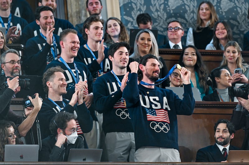 WASHINGTON, DC - FEBRUARY 24:  The U.S. men's Olympic ice hockey team with Connor Hellebuyck in front attend President Donald Trump's State of the Union address to a joint session of Congress in the House Chamber at the Capitol on February 24, 2026 in Washington, DC. Behind him are Vice President JD Vance and House Speaker Mike Johnson (R-LA). Trump delivered his address days after the Supreme Court struck down the administration's tariff strategy, and amid a U.S. military buildup in the Persian Gulf threatening Iran. (Photo by Kenny Holston-Pool/Getty Images)