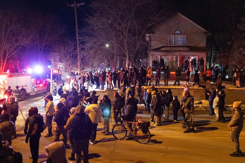 MINNEAPOLIS, MINNESOTA - JANUARY 14: Residents confront federal agents following a shooting incident on January 14, 2026 in Minneapolis, Minnesota. According to reports, a federal agent shot a Venezuelan man who was resisting arrest. The Trump administration has sent a reported 2,000 federal plus federal agents into the area, with more on the way, as they make a push to arrest undocumented immigrants in the region. The Trump administration has sent a reported 2,000 federal plus federal agents into the area, with more on the way, as they make a push to arrest undocumented immigrants in the region. (Photo by Scott Olson/Getty Images)
