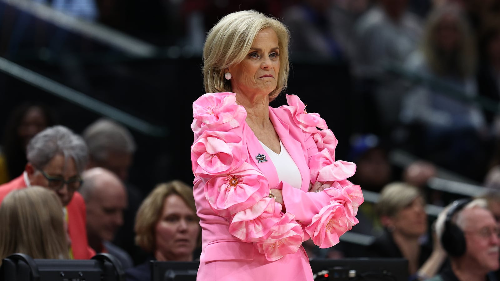 Kim Mulkey stands at an LSU basketball game