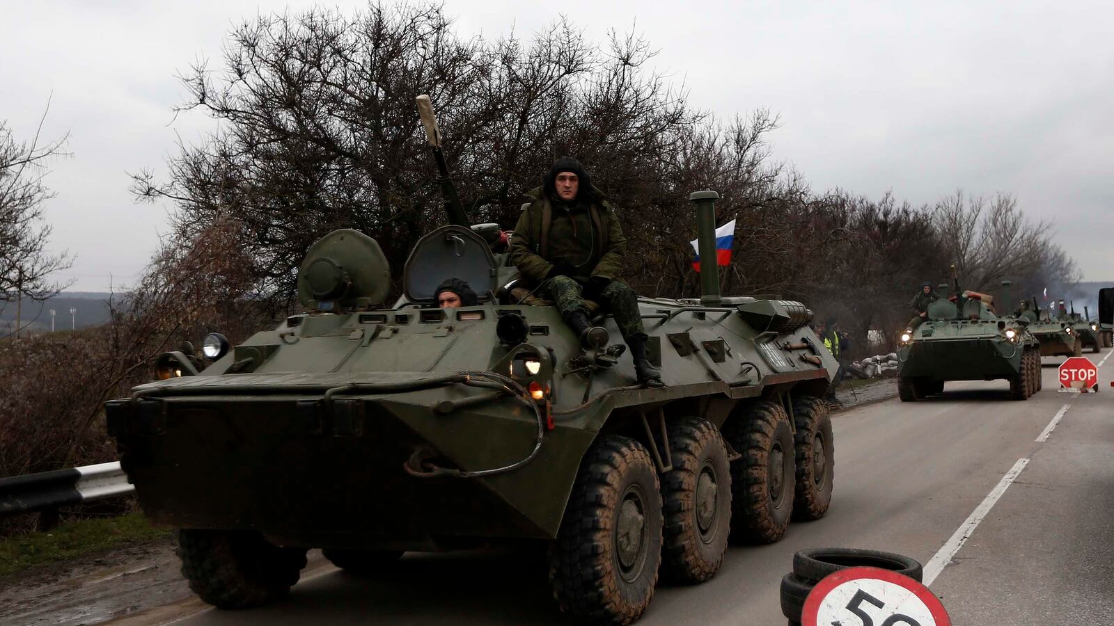 articles/2014/02/28/putin-s-shadow-shock-troops-roil-ukraine/140228-ukriane-russia-tease_ycvnhf