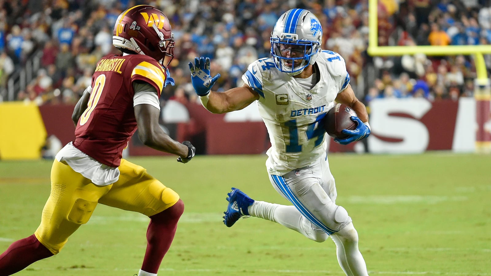 Lions wide receiver Amon-Ra St. Brown (14) runs after a catch during the Detroit Lions versus Washington Commanders National Football League game at Northwest Stadium on November 9, 2025 in Landover, MD.