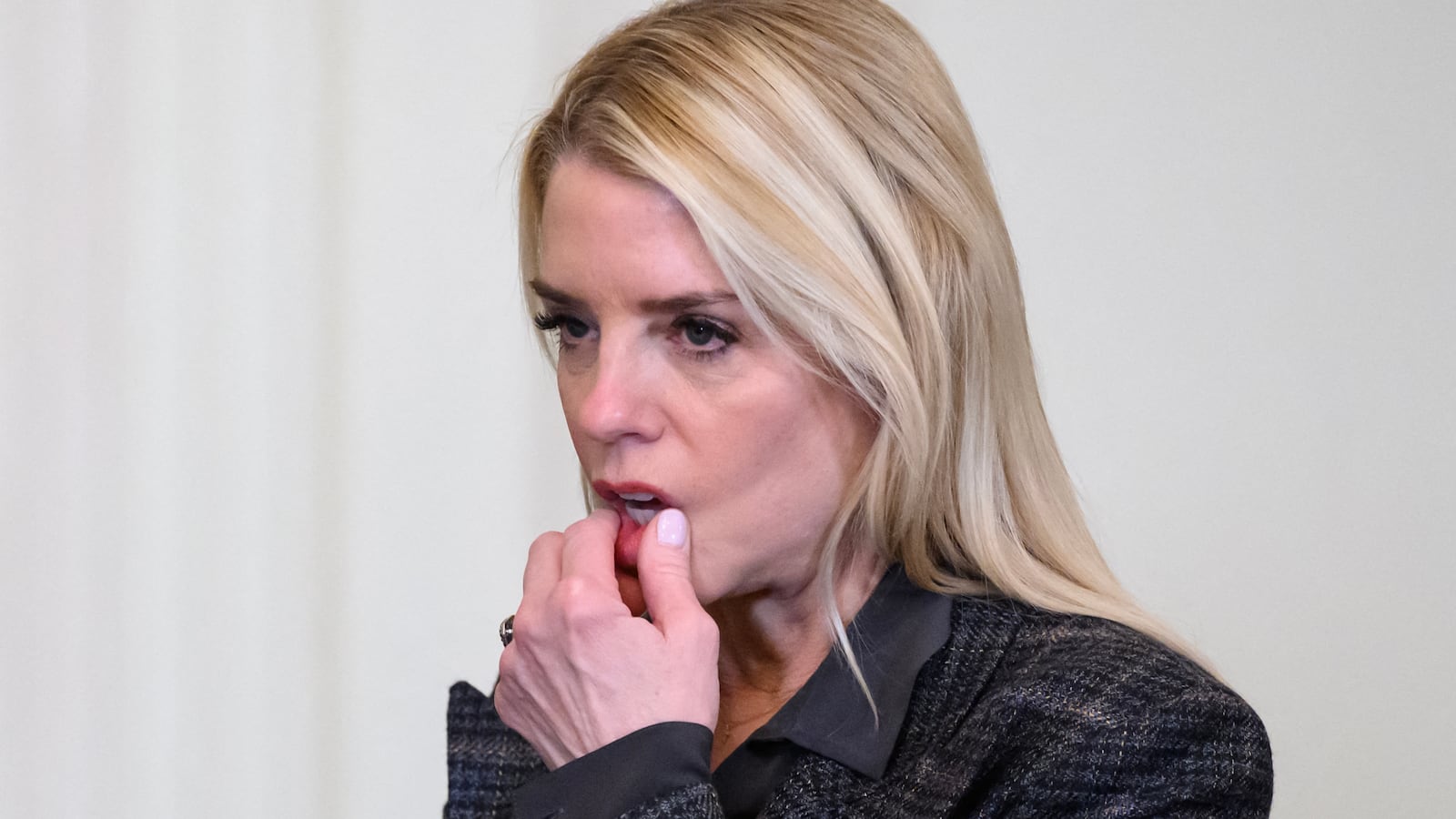 Attorney General Pam Bondi (R) speaks with the Deputy Attorney General Todd Blanche following a ceremony with President Donald Trump and the Florida Panthers of the National Hockey League, winners of the 2025 Stanley Cup, in the East Room of the White House in Washington, DC on January 15, 2026.