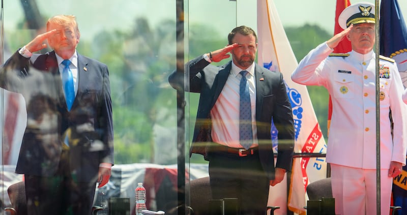 U.S. President Donald Trump, DHS Secretary Markwayne Mullin, and Admiral Kevin Lunday salute during the United States Coast Guard's 145th Commencement exercises on May 20, 2026.