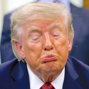 President Donald Trump reacts while answering a reporters question during a healthcare affordability event in the Oval Office at the White House on August 31, 2026 in Washington, DC.
