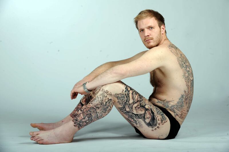 galleries/2011/11/30/world-records-broken-in-2011-photos/world-records-longest-tattoo-session_xhfxcb