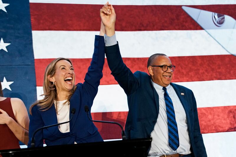 New Jersey Democratic gubernatorial candidate Rep. Mikie Sherrill celebrates victory with running made Dale Caldwell on November 4, 2025 in East Brunswick, New Jersey.