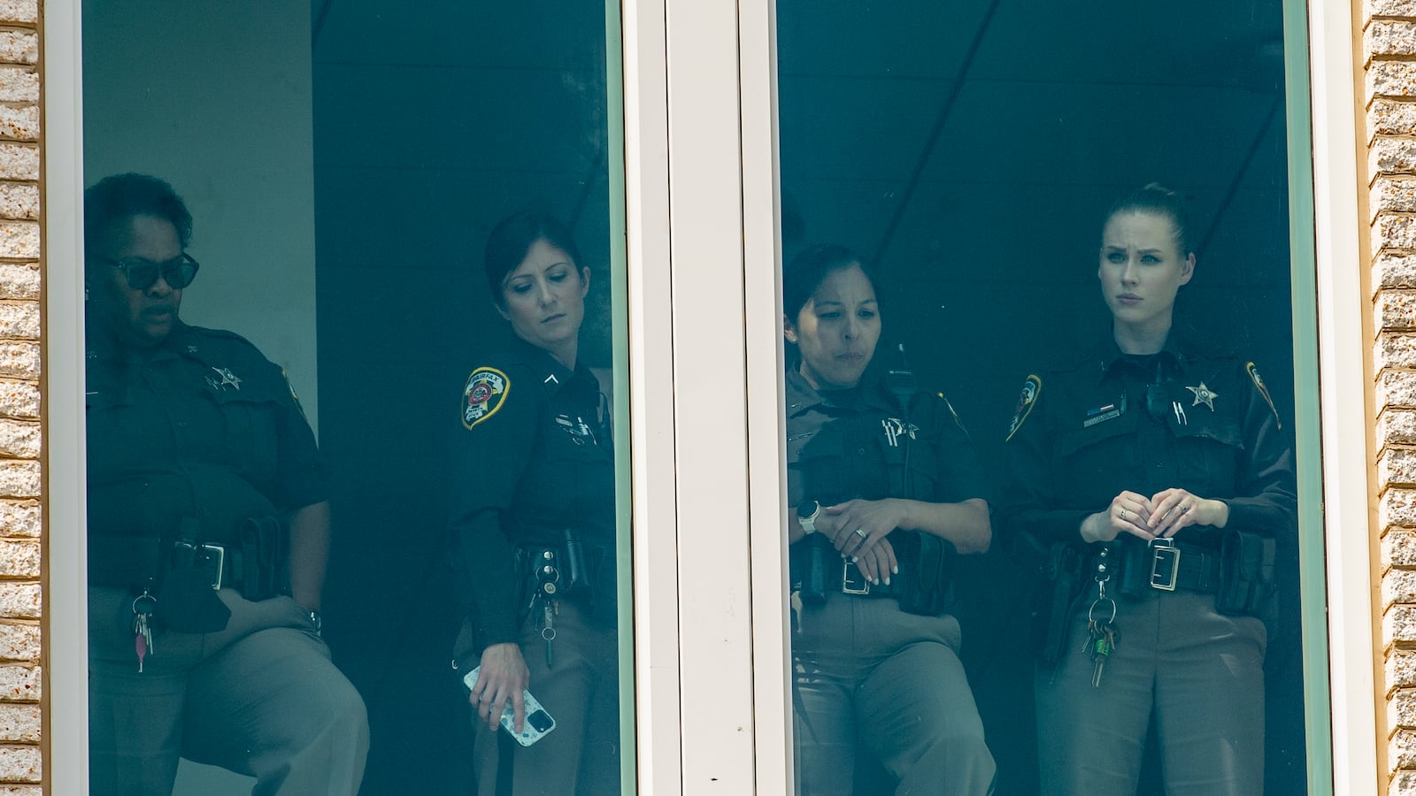 Fairfax County sheriffs waiting at the Fairfax County Courthouse.
