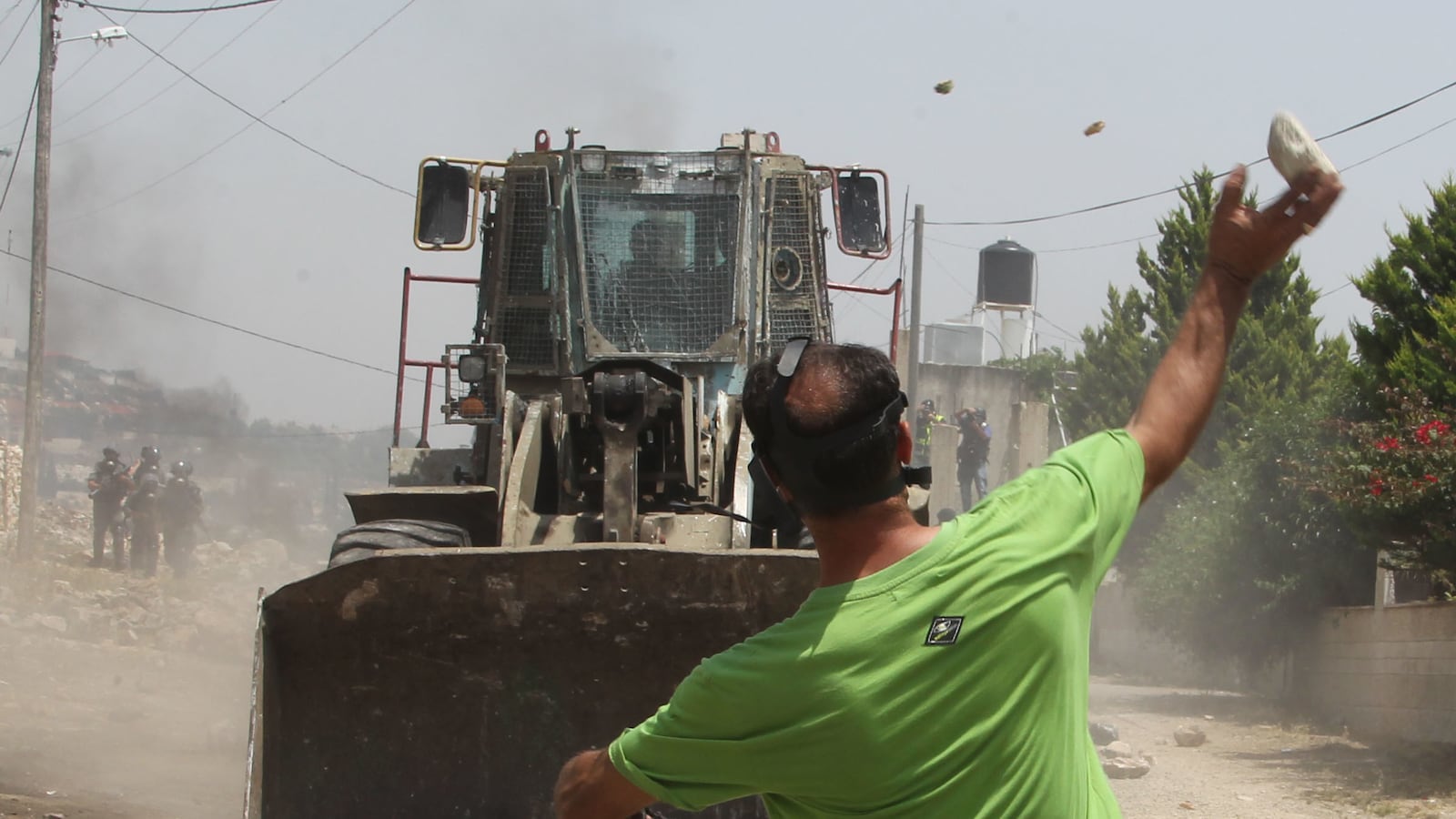 articles/2013/08/09/what-s-wron-with-the-discourse-about-throwing-rocks/stone-bulldozer-openz_l5pilo