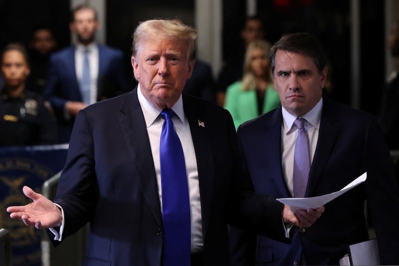 Former U.S. President Donald Trump speaks alongside his attorney Todd Blanche as he arrives for his hush money trial at Manhattan Criminal Court on May 30, 2024 in New York City. The second day of jury deliberations in the hush money trial of the former president are underway. Michael Cohen's $130,000 payment to Stormy Daniels is tied to former U.S. President Trump's 34 felony counts of falsifying business records in the first of his criminal cases to go to trial.     Michael M. Santiago/Pool via REUTERS