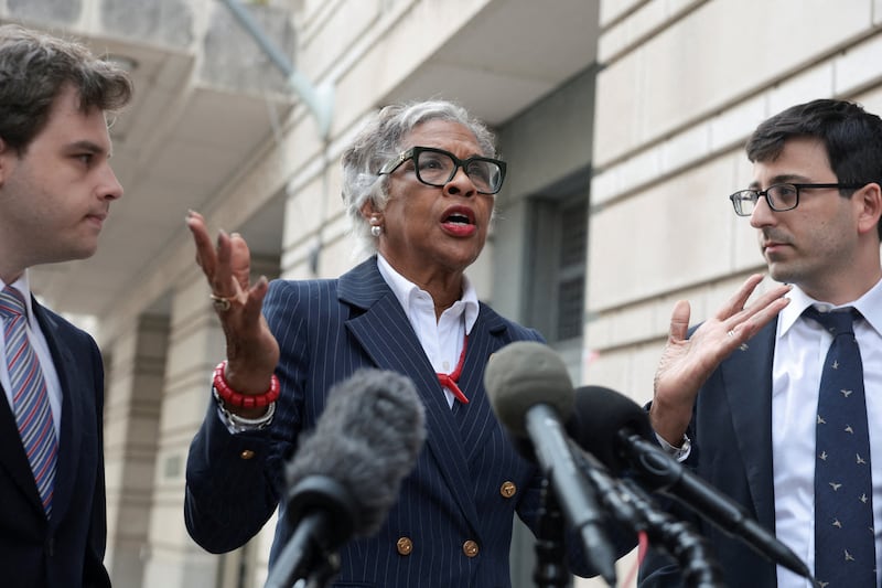U.S. Representative Joyce Beatty (D-OH), ex officio member of the Kennedy Center Board of Trustees speaks to the media next to lawyers Joshua Kolb and Nathaniel Zelinsky outside the U.S. District Courthouse on the day of a hearing on a new legal challenge that seeks to block U.S. President Donald ‌Trump's name from being inscribed on the John F. Kennedy Center for the Performing Arts, in Washington, D.C., U.S., August 27, 2026.