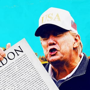 Donald Trump holding a presidential pardon at a golf course.