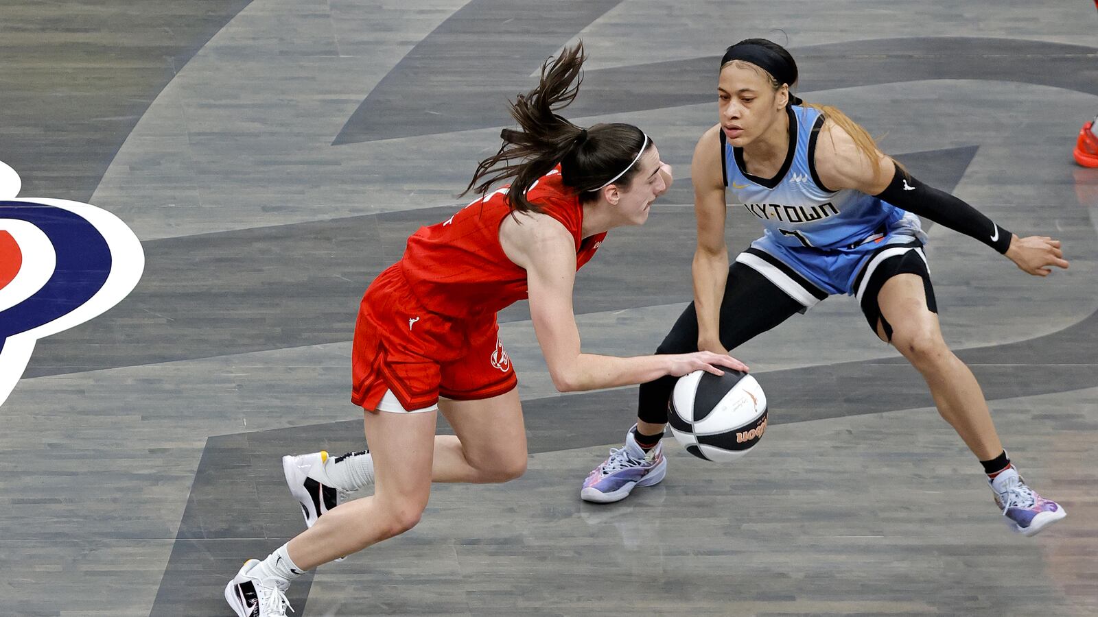 Indiana Fever guard Caitlin Clark (left) drives to the basket against Chicago Sky guard Chennedy Carter (right) on June 1.