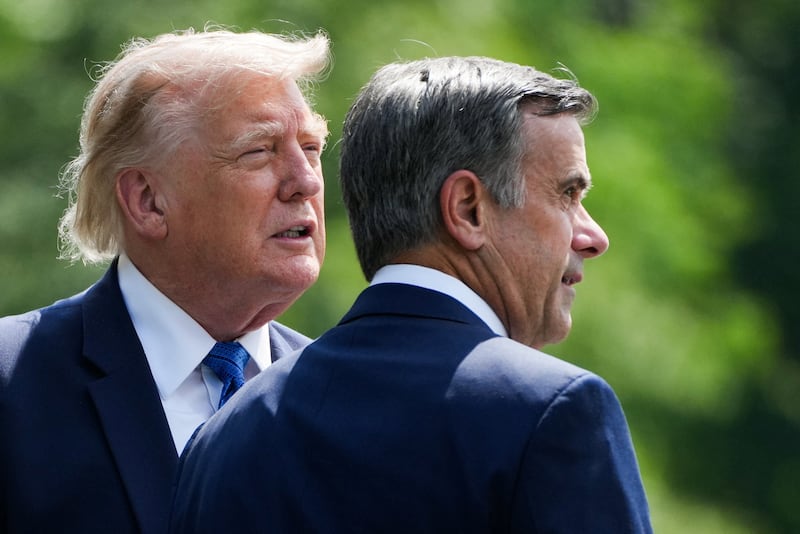 U.S. President Donald Trump and John Ratcliffe, Director of the Central Intelligence Agency (CIA), speak as they depart after a Cabinet meeting at Camp David in Thurmont, Maryland, U.S., July 31, 2026.
