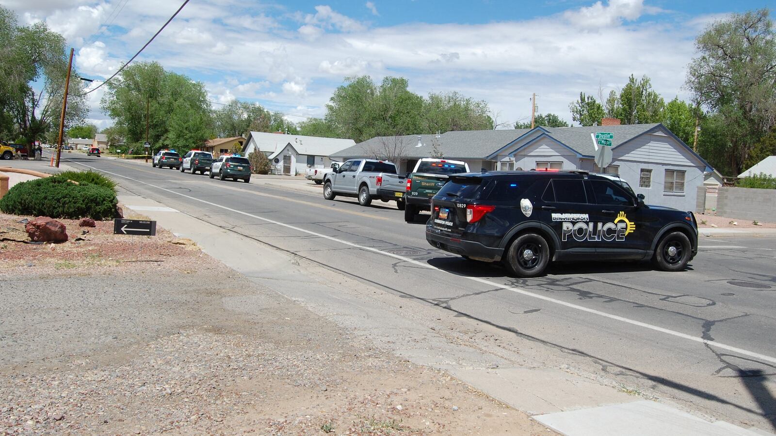 Law enforcement officers from the Farmington Police Department, San Juan County Sheriff's Office and New Mexico State Police deploy at the scene of a fatal shooting in Farmington, New Mexico, U.S. May 15, 2023.