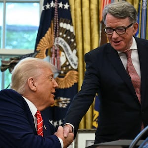 US President Donald Trump shakes hands with British ambassador to the United States Peter Mandelson  after making a trade announcement in the Oval Office of the White House in Washington, DC, on May 8, 2025.