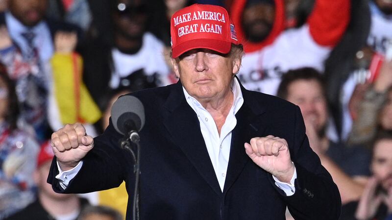 Donald Trump gestures as he speaks during a rally at the Canyon Moon Ranch festival grounds in Florence, Arizona, southeast of Phoenix, on January 15, 2022.