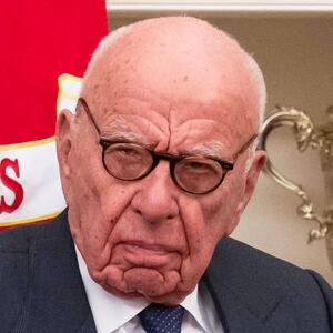 Media mogul Rupert Murdoch looks on as President Donald Trump speaks to members of the media as he signs proclamations, initiatives and appointments inside the Oval Office at the White House in Washington, DC on February 03, 2025.